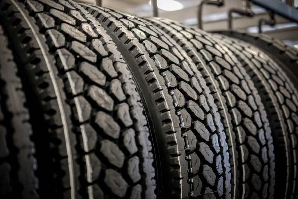 A row of finished AcuTread® retreated tires ready for redistribution to their fleet owners.