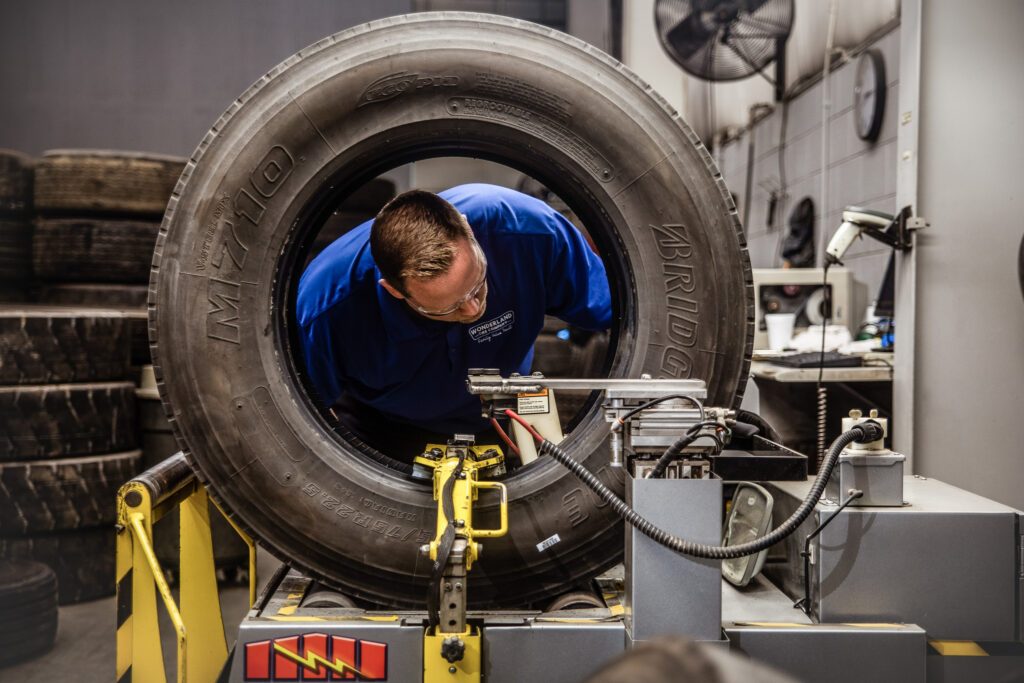 A trained AcuTread® inspection technician is looking for specific tire conditions that either qualify or disqualify the tire casing for retreading.