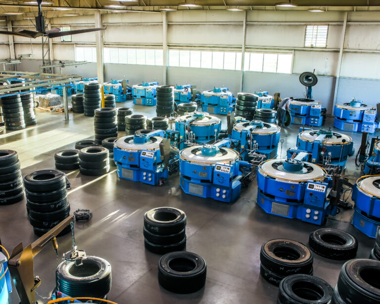 Interior of an AcuTread tire retreading plant, showcasing the mold curing presses