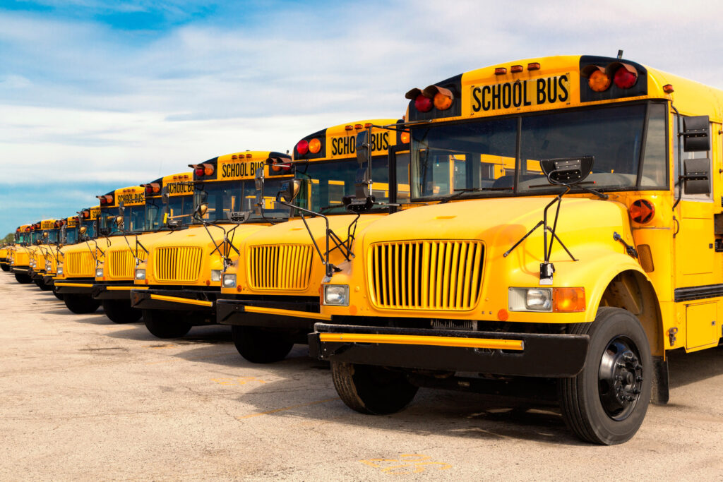 School busses in a line, ready for retreaded tires