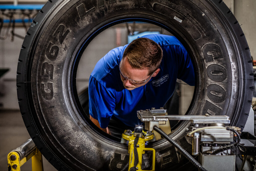 A trained AcuTread® inspection technician evaluates a commercial Goodyear tire to see if it qualifies for retreading.